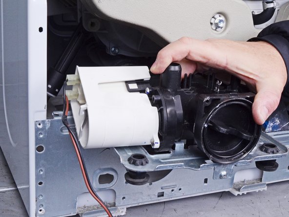 LG Front Load Washing Machine Drain Pump Motor Replacement, Remove the pump assembly: crwdns2935265:036crwdnd2935265:03crwdnd2935265:03crwdne2935265:0