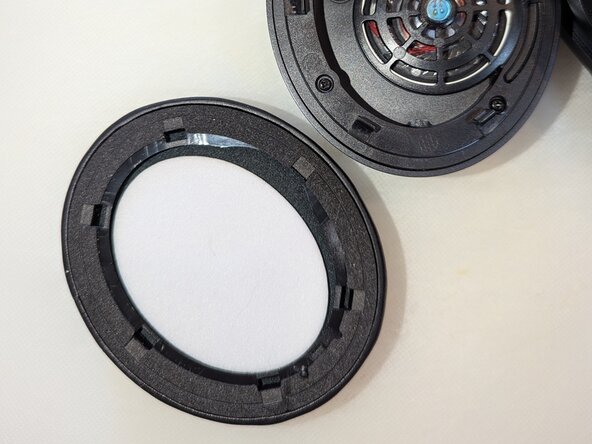 Soundcore Headphone Battery Replacement, Locate LEFT earpiece and remove speaker cover.: crwdns2935265:01crwdnd2935265:03crwdnd2935265:03crwdne2935265:0