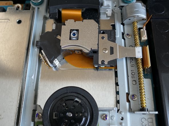 PlayStation 2 Slimline PVR-802W Laser Replacement, Place the new laser in: crwdns2935265:010crwdnd2935265:02crwdnd2935265:03crwdne2935265:0