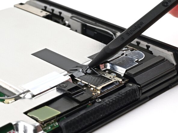 Nintendo Switch 2 MicroSD Card Reader Replacement, Lift the tape: crwdns2935265:020crwdnd2935265:02crwdnd2935265:03crwdne2935265:0