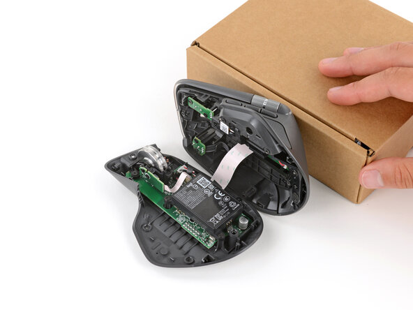 Logitech MX Master 4 Battery Replacement, Prop up the top half: step 5, image 2 of 2