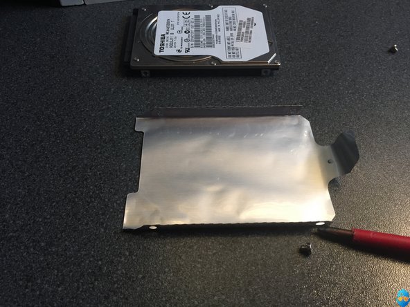Toshiba Satellite L670 HDD replacement, Unscrew the HDD cover: crwdns2935265:06crwdnd2935265:02crwdnd2935265:02crwdne2935265:0