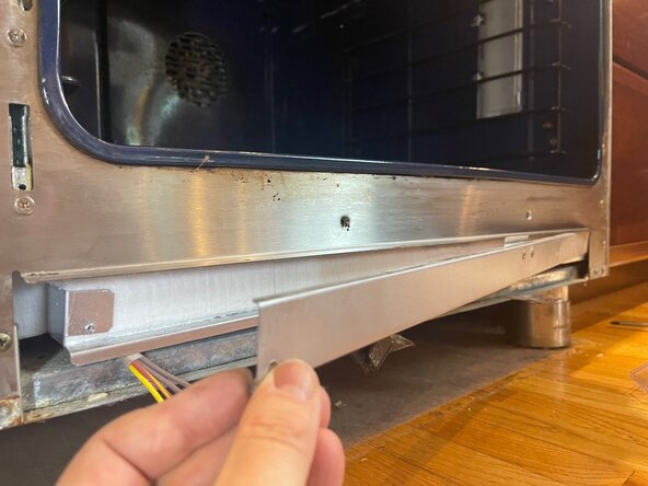 GE Monogram Dual Fuel Range Model ZDP486NDP4SS Hidden Bake Element Replacement, Remove Baking Element Cover: step 6, image 2 of 3