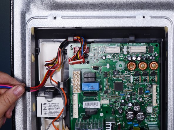 LG Refrigerator Ice Auger Motor Run Capacitor Replacement, Reposition the wiring harness: crwdns2935265:05crwdnd2935265:02crwdnd2935265:02crwdne2935265:0