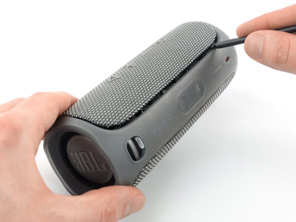 JBL Flip 5 Battery Replacement, Loosen the fabric cover edge: crwdns2935265:03crwdnd2935265:03crwdnd2935265:03crwdne2935265:0