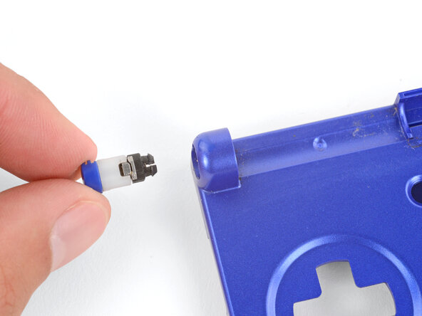 How to Reshell Your Game Boy Advance SP, Remove the left hinge: crwdns2935265:031crwdnd2935265:03crwdnd2935265:03crwdne2935265:0