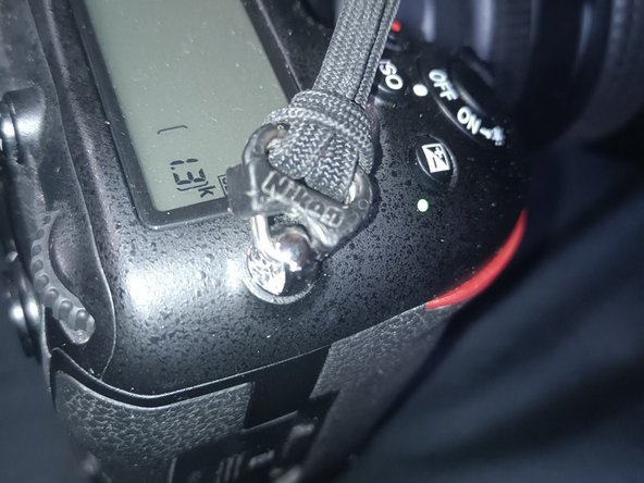 Nikon D500 Top Assembly Replacement, Reattach the strap: crwdns2935265:022crwdnd2935265:02crwdnd2935265:02crwdne2935265:0