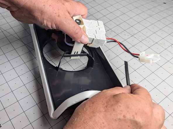 Frigidaire Side-By-Side Refrigerator Evaporator Fan Replacement, Unhook the fan motor bracket: 21 단계, 이미지 3개 중 3개