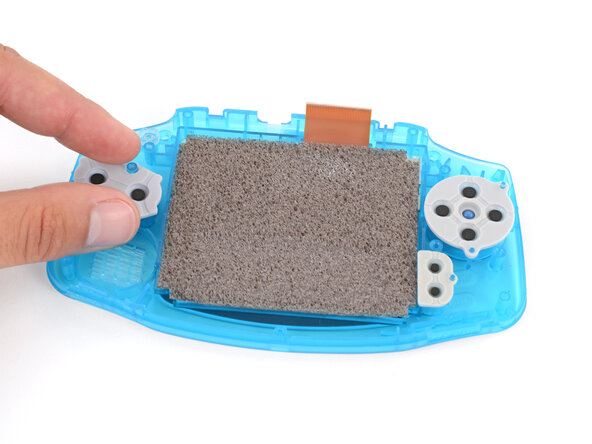 How to Reshell Your Game Boy Advance, Install the silicone pads: crwdns2935265:025crwdnd2935265:03crwdnd2935265:03crwdne2935265:0