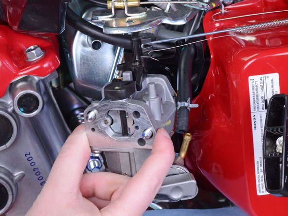 Honda FC600 Tiller Carburetor Replacement, Disconnect the Throttle Spring and Governor Rod: crwdns2935265:018crwdnd2935265:02crwdnd2935265:02crwdne2935265:0