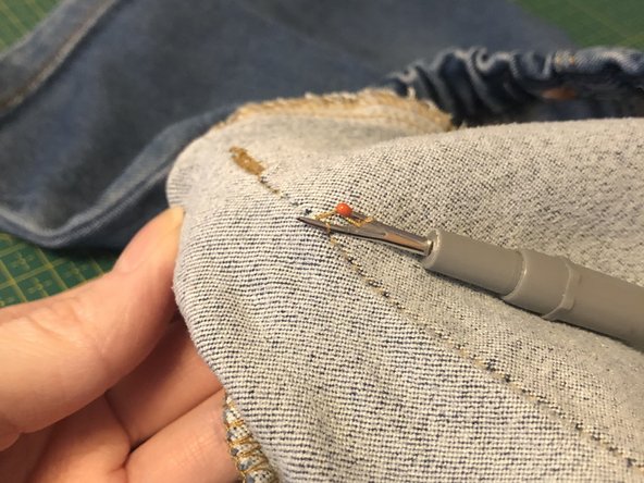 Mend a tear at the knee, by hand, with no-waste patch. Replacement: crwdns2935265:03crwdnd2935265:02crwdnd2935265:02crwdne2935265:0