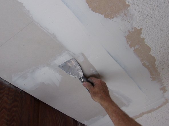 Use joint compound to fill the slight depressions over each screw and any blemishes in the surface of the new piece. Pic 3.