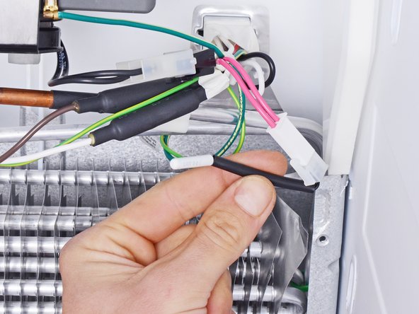 Whirlpool Refrigerator Freezer Thermistor Replacement, Unclip the thermistor: crwdns2935265:07crwdnd2935265:03crwdnd2935265:03crwdne2935265:0