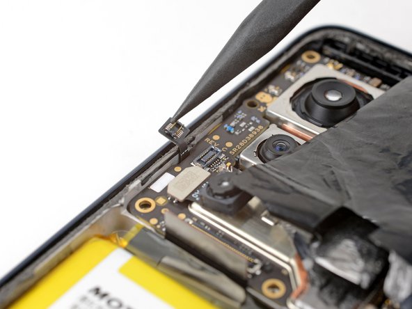 Motorola Edge (2022) Screen Replacement, Disconnect the button assembly cable: crwdns2935265:044crwdnd2935265:02crwdnd2935265:02crwdne2935265:0