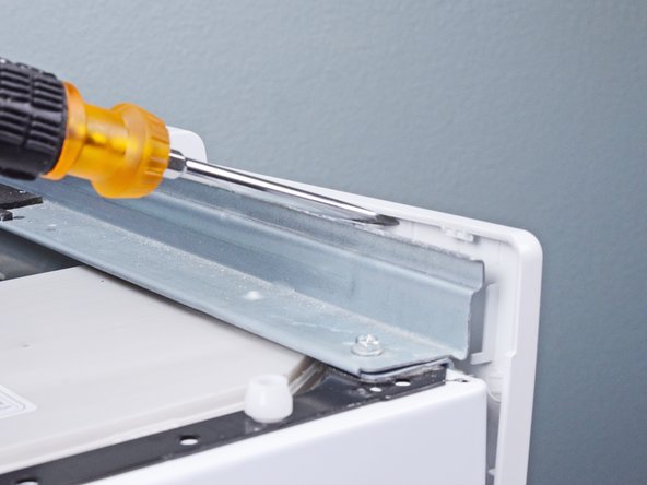 LG Front Load Washing Machine Temperature Sensor Replacement, Unclip the control panel: crwdns2935265:010crwdnd2935265:03crwdnd2935265:03crwdne2935265:0