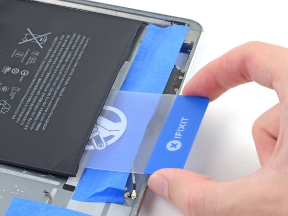 iPad Pro 9.7" Battery Replacement, Slice through the adhesive strip: step 118, image 2 of 3