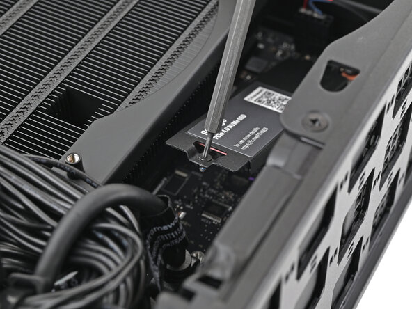 Framework Desktop DIY Edition Quick Start Guide, Loosen the primary storage screw: crwdns2935265:08crwdnd2935265:03crwdnd2935265:03crwdne2935265:0