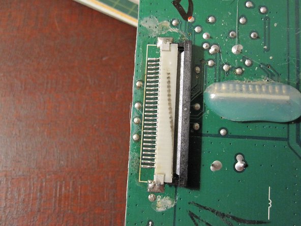 Disassembling Philips Wake-Up HF35xx Main PCB, Detach ribbon cable: step 9, image 2 of 3