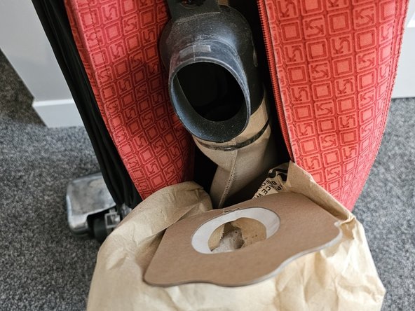 Kirby Heritage I Filter Bag Replacement, Pull up on the top of the cardboard connector to get the bag loose: step 5, image 1 of 1