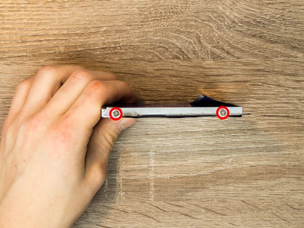 Lenovo Ideapad Y700 15-ISK Hard Drive Replacement, Removing the bracket.: crwdns2935265:04crwdnd2935265:02crwdnd2935265:03crwdne2935265:0