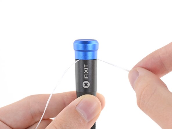 How to Reattach the Cap on a 4 mm iFixit Precision Bit Driver, Remove the floss: crwdns2935265:08crwdnd2935265:02crwdnd2935265:03crwdne2935265:0