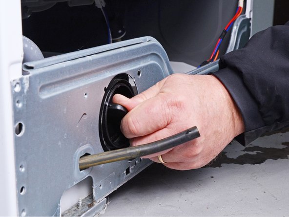 LG Front Load Washing Machine Drain Pump Motor Replacement, Remove the pump filter: crwdns2935265:027crwdnd2935265:02crwdnd2935265:03crwdne2935265:0