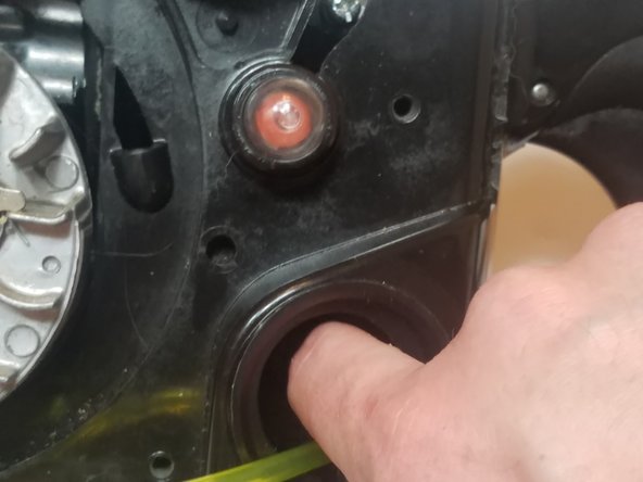 Cut the smaller diameter fuel line (fuel return line) and push it into the gas tank