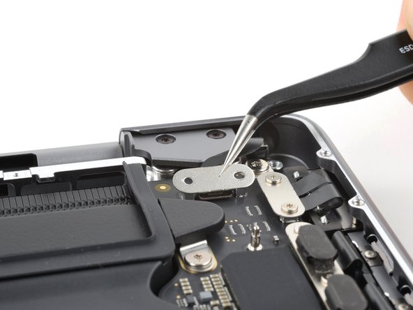 MacBook Pro 14" Late 2023 (M3) Screen Replacement, Remove the lid angle sensor connector cover: crwdns2935265:033crwdnd2935265:02crwdnd2935265:03crwdne2935265:0