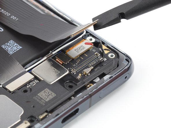 Mi 11 Screen Replacement, Remove the right interconnect cable: crwdns2935265:018crwdnd2935265:02crwdnd2935265:03crwdne2935265:0