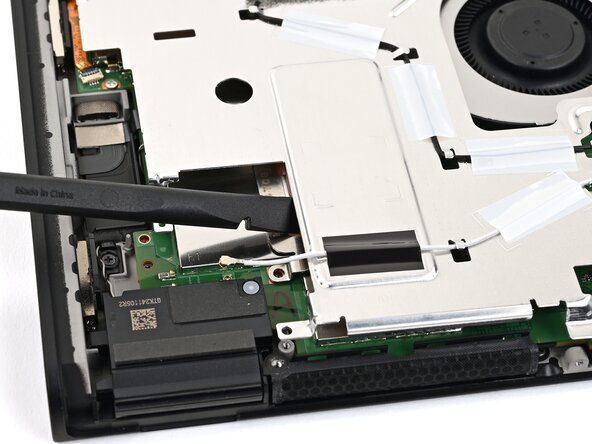 Nintendo Switch 2 Microphone Replacement, Lift the shield plate: crwdns2935265:027crwdnd2935265:03crwdnd2935265:03crwdne2935265:0