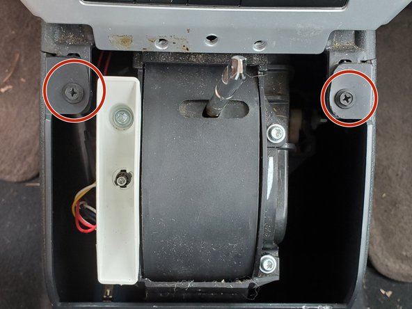 2007-2012 Jeep Patriot Shifter Bushing Replacement, Remove the Screws From the Console: crwdns2935265:00crwdnd2935265:01crwdnd2935265:02crwdne2935265:0