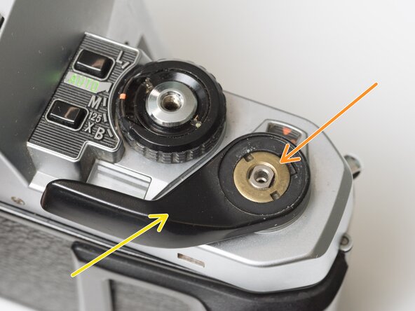 Pentax Super Program Top Cover Removal, Remove film advance lever: crwdns2935265:01crwdnd2935265:02crwdnd2935265:03crwdne2935265:0