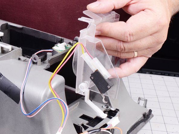 LG Refrigerator Water Dispensing Switch Testing and Replacement, Remove the switch bracket: crwdns2935265:013crwdnd2935265:02crwdnd2935265:02crwdne2935265:0