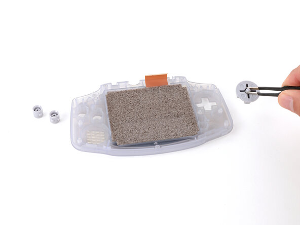 Game Boy Advance Screen Lens Replacement, Remove the buttons: crwdns2935265:014crwdnd2935265:03crwdnd2935265:03crwdne2935265:0