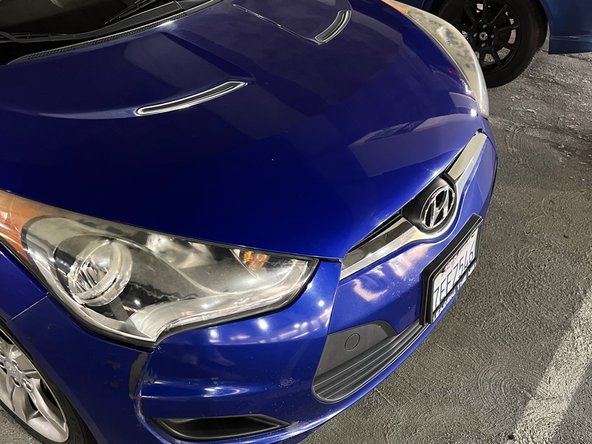 2014 Hyundai Veloster Headlight Replacement: step 7, image 2 of 3