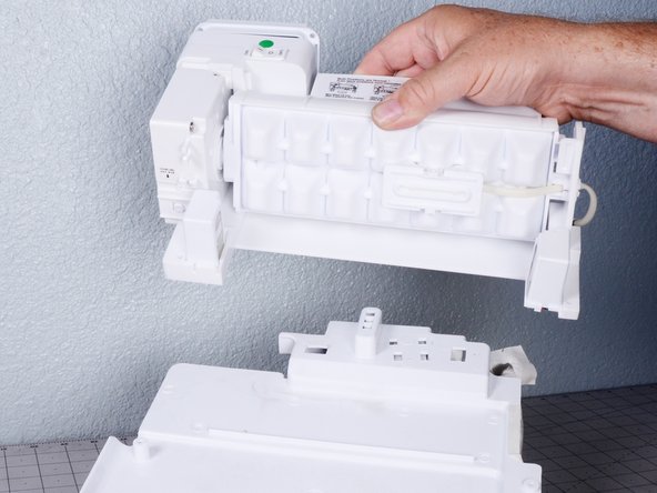 Upper Ice Maker Replacement, Remove the ice maker from the back plate: crwdns2935265:018crwdnd2935265:02crwdnd2935265:02crwdne2935265:0