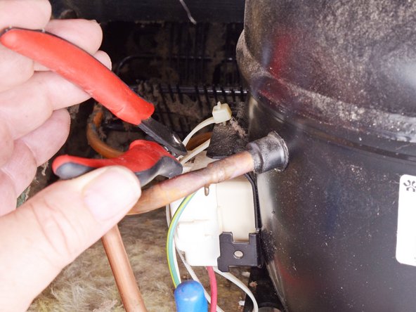 Whirlpool Refrigerator Motor Thermal Protector and Start Relay Assembly Replacement, Remove the thermal protector and start relay: step 4, image 1 of 1