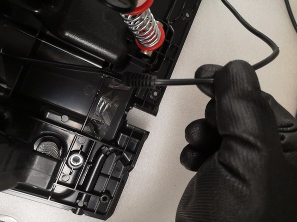 Thrustmaster T3PM RJ12 main cable Replacement, Remove tape: crwdns2935265:05crwdnd2935265:03crwdnd2935265:03crwdne2935265:0