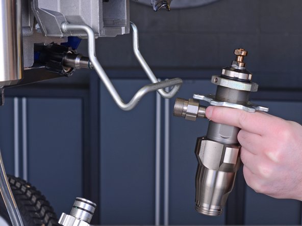 Remove the pump from the paint sprayer.