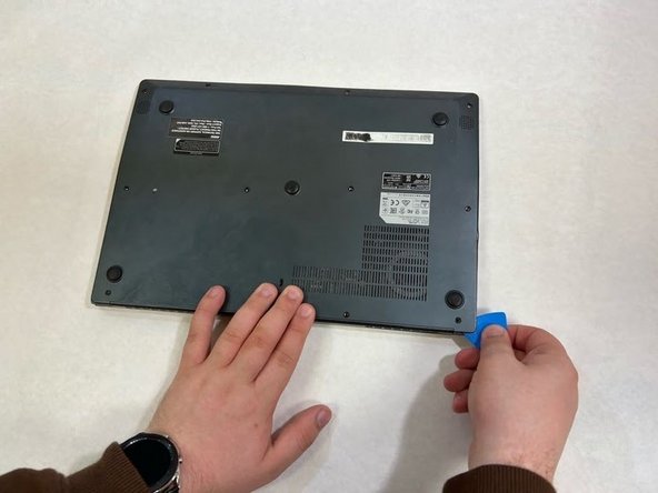MSI Modern 14 A10M Laptop Battery Replacement, Begin Prying Off Back Cover: step 7, image 2 of 2