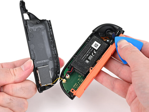 Joy-Con 2 (Right) Joystick Replacement, Install the back cover: crwdns2935265:046crwdnd2935265:01crwdnd2935265:03crwdne2935265:0