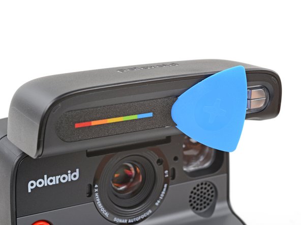 Polaroid Flash Unit Shell Replacement, Remove the screw cover: crwdns2935265:03crwdnd2935265:03crwdnd2935265:03crwdne2935265:0