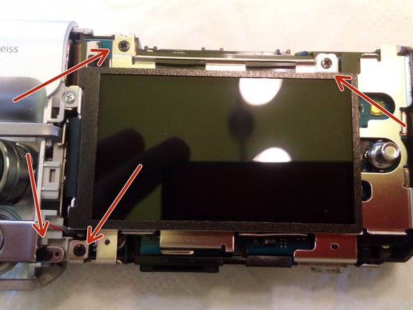 Desmontagem da câmera de vídeo Sony MV1, Remover o suporte metálico do visor: crwdns2935265:03crwdnd2935265:03crwdnd2935265:03crwdne2935265:0