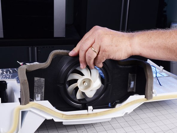 LG Refrigerator Evaporator Fan Replacement, Unfasten and remove the evaporator fan assembly: crwdns2935265:024crwdnd2935265:02crwdnd2935265:03crwdne2935265:0