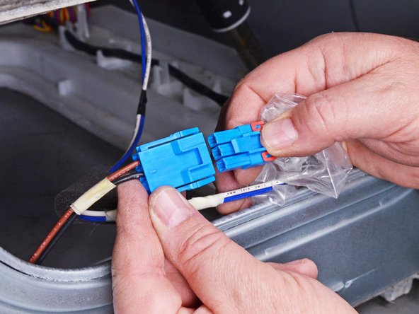 LG Front Load Washing Machine Drain Pump Motor Replacement, Disconnect the pump cable: crwdns2935265:031crwdnd2935265:02crwdnd2935265:02crwdne2935265:0