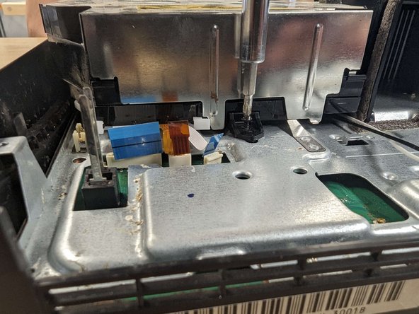 PlayStation 3 Slim Thermal Paste Replacement, Removing Blu-ray drive: crwdns2935265:012crwdnd2935265:03crwdnd2935265:03crwdne2935265:0