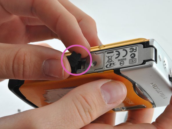 Olympus 850SW Battery Latch Replacement: step 3, image 1 of 1