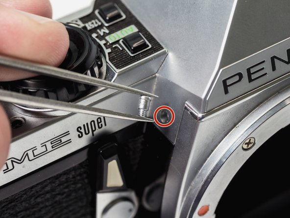 Pentax ME Super Front Board and Mirror Box Removal, Unscrew top cover: crwdns2935265:05crwdnd2935265:02crwdnd2935265:02crwdne2935265:0