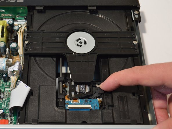 Dynex DX-WBRDVD1 Cleaning The Optical Lens, Dynex DX-WBRDVD1 Cleaning The Optical Lens: crwdns2935265:04crwdnd2935265:02crwdnd2935265:02crwdne2935265:0