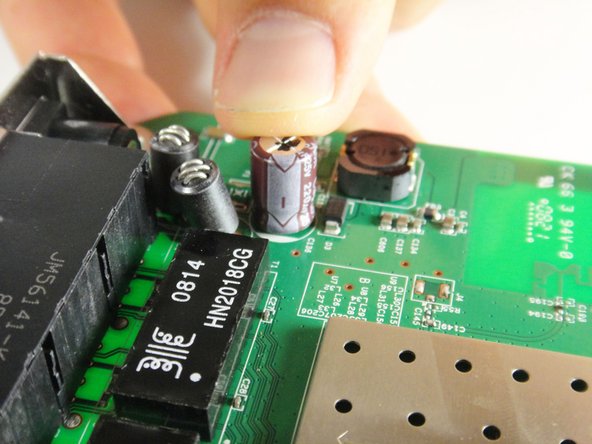 Netgear WGR614v9 Capacitor Replacement: crwdns2935265:08crwdnd2935265:02crwdnd2935265:02crwdne2935265:0